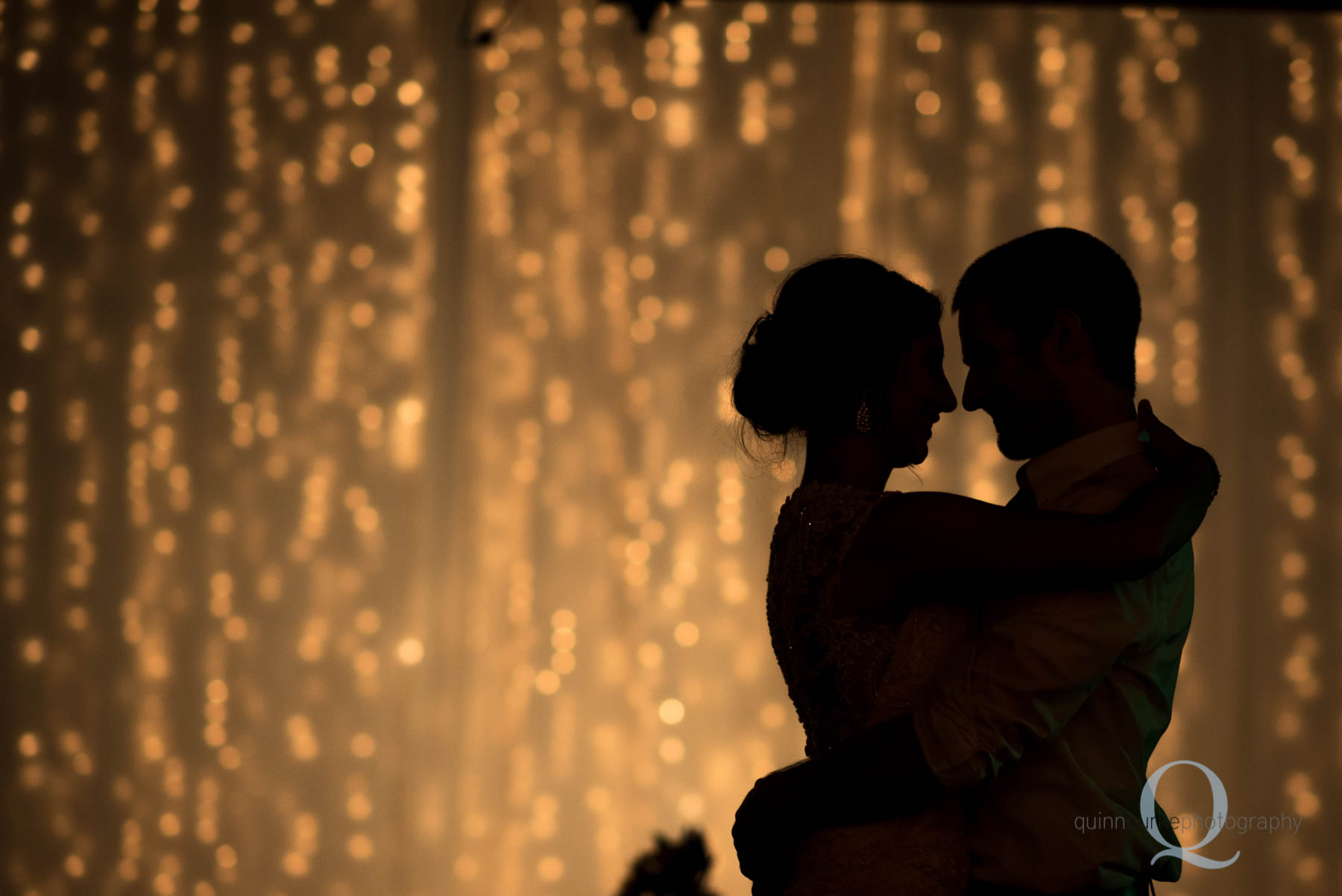 bride and groom silhouette during wedding reception Green Villa Barn Salem Oregon