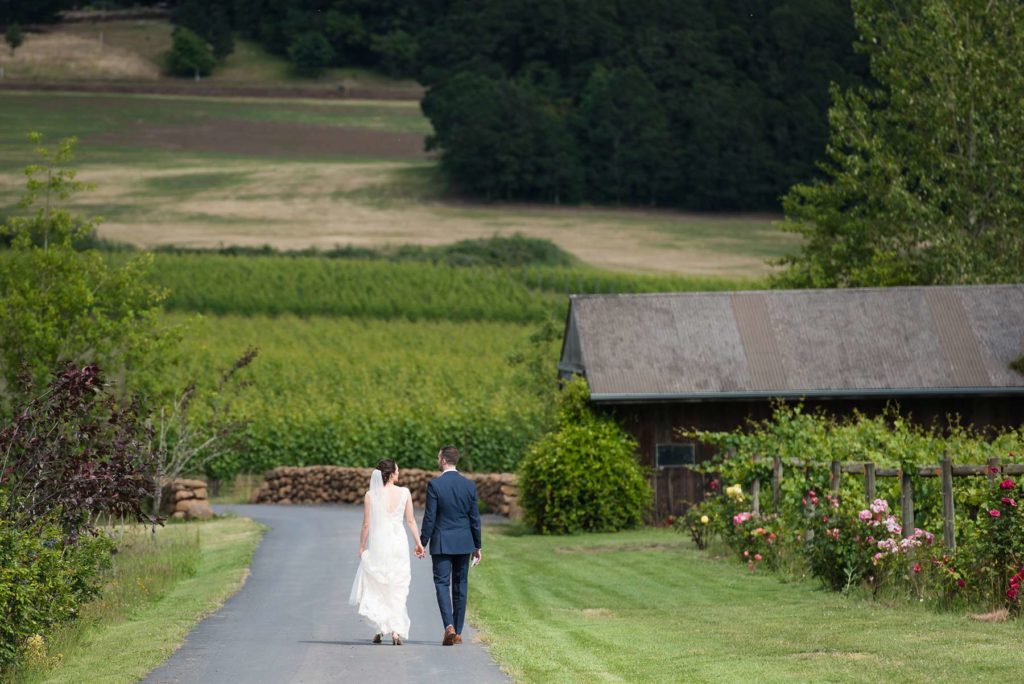 bride groom walking in zenith vineyard wedding outdoor salem oregon